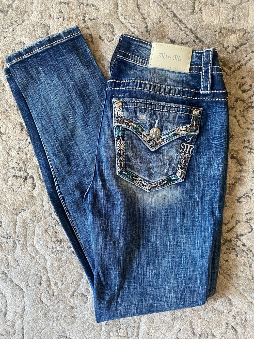 Miss Me Blue Mid Rise Skinny Jeans with Embellished Pocket. Size 28. Inseam 30.